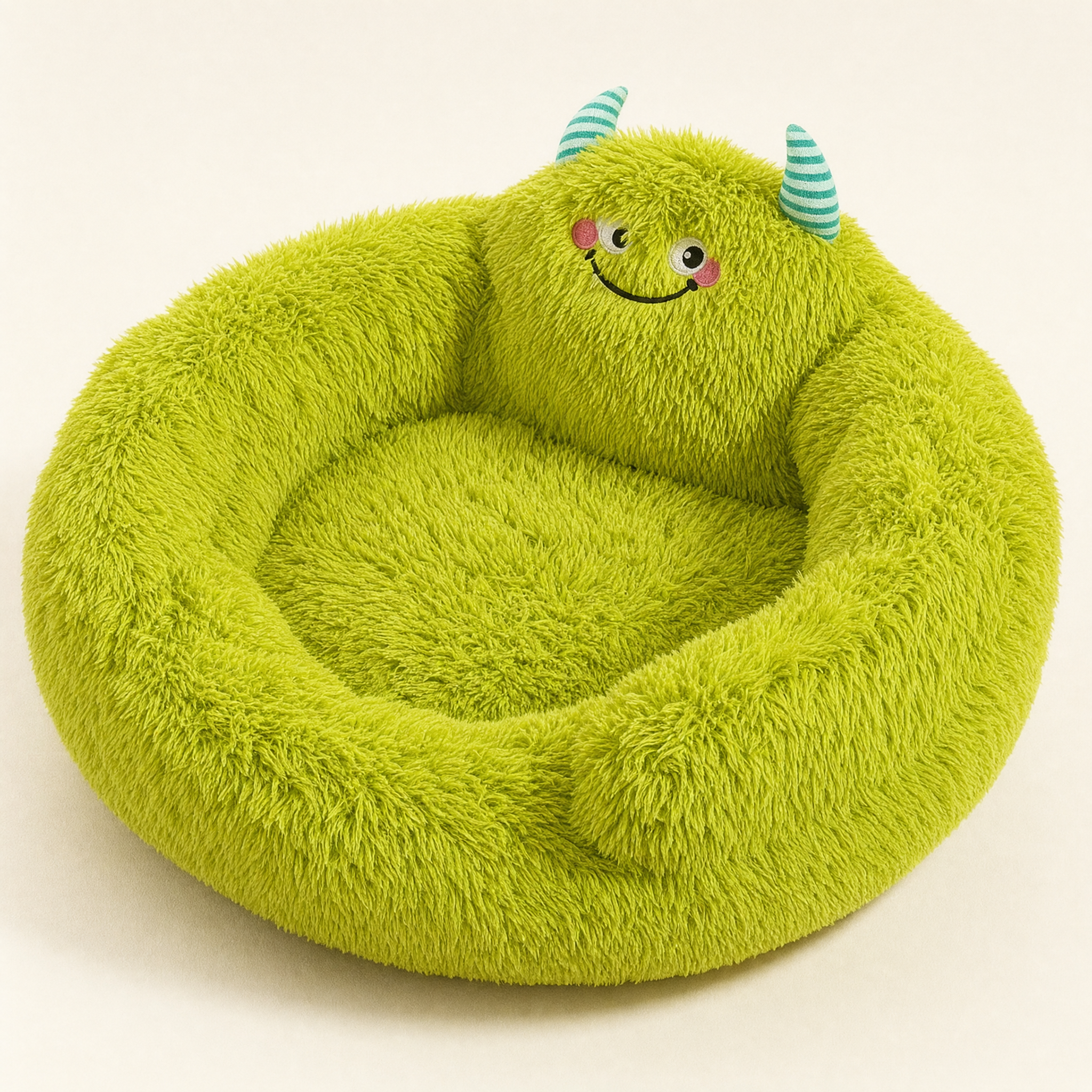Green plush monster nest bed with striped horns, studio view on cream background