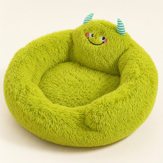 Green plush monster nest bed with striped horns, studio view on cream background