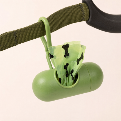 Poop bag dispenser clipped onto a leash handle