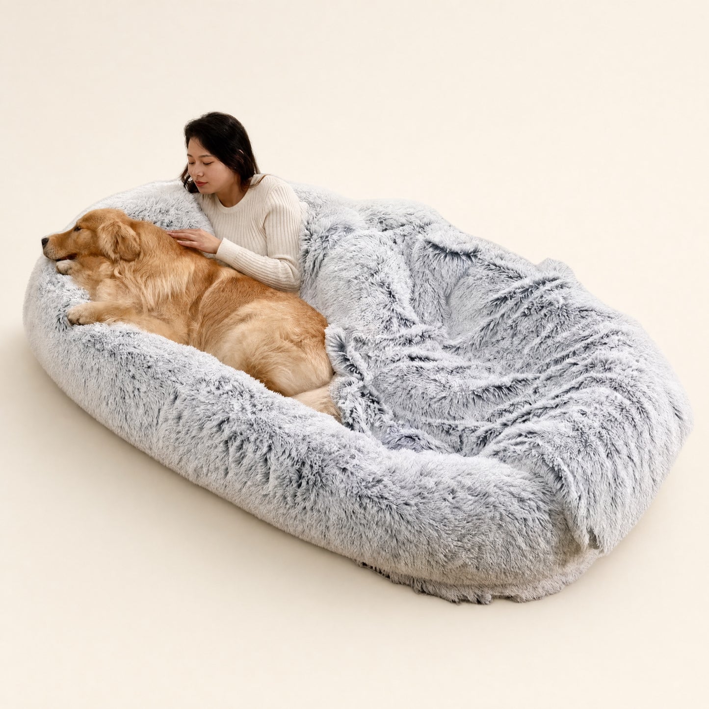 Giant human-size plush dog bed with owner and golden retriever resting